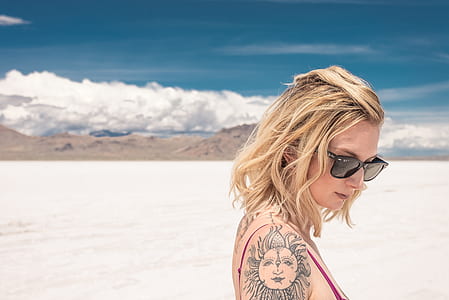 portrait of woman on desert during day time thumbnail