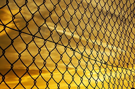 silhouette of black chain-link fence thumbnail
