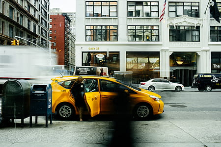 woman stepping out yellow car thumbnail