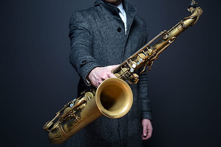 person holding saxophone thumbnail