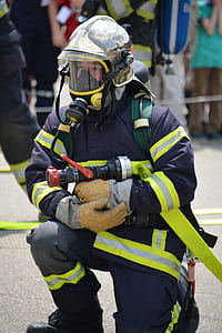 man holding fire hose thumbnail