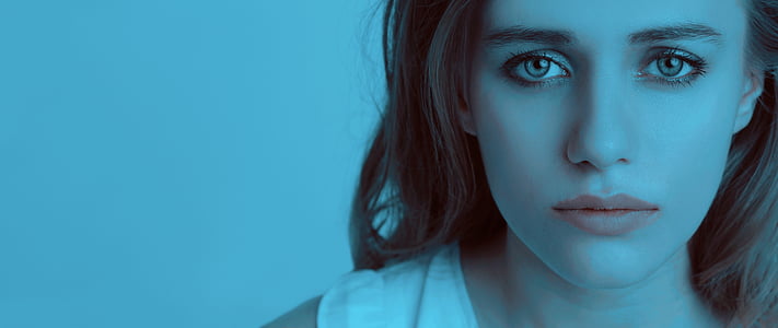 woman wearing white shirt with blue background thumbnail