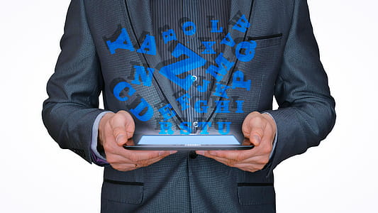 Letters pouring from a handheld tablet device. Ebook concept. thumbnail