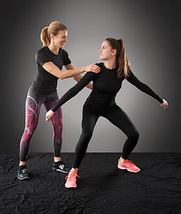 two women wearing tights doing exercise thumbnail