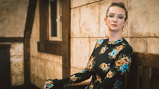 woman laying on brown chair thumbnail
