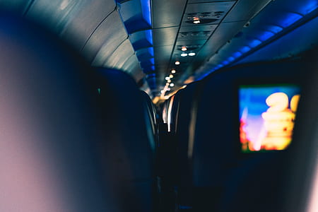 selective focus photography of plane hallway thumbnail