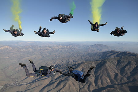 seven person performing on the air with parachute thumbnail