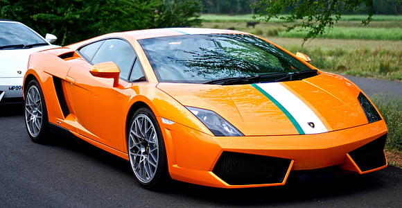orange Lamborghini Gallardo parked on road at daytime thumbnail