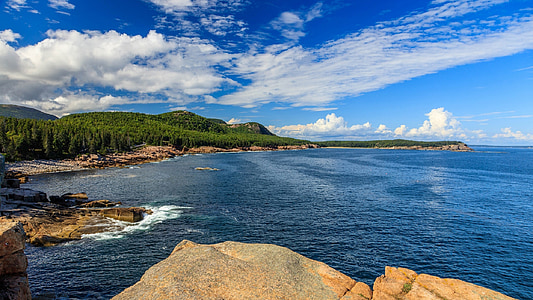blue ocean near green trees at daytime thumbnail