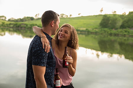 woman leaning her right hand on man's shoulder thumbnail