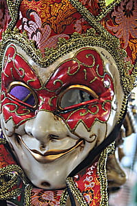 shallow focus photography of red and white venetian mask thumbnail