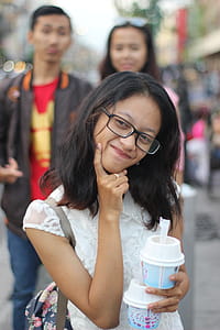 Close-Up Photography of Girl Wearing Eyeglasses thumbnail