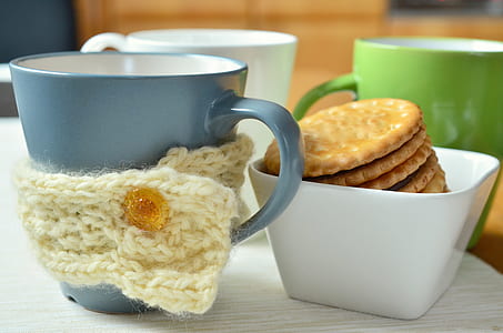 biscuits in white container near cups thumbnail