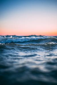 body of water waves at golden hour thumbnail