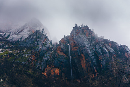 lava erupted mountain under cloudy sky during daytime thumbnail