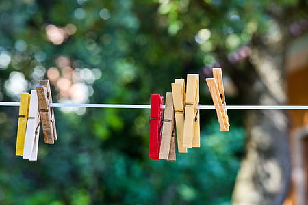 closeup photo of clothes pin on clothes line at daytime thumbnail