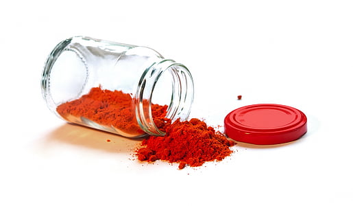 clear glass mason jar with red powder thumbnail