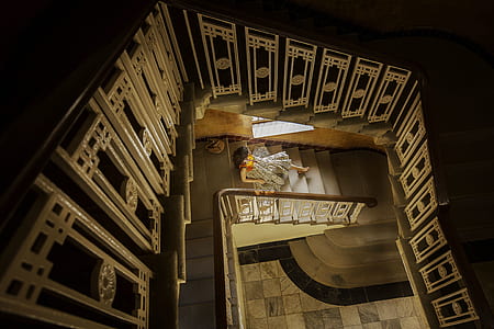 woman sitting on stairway inside room thumbnail
