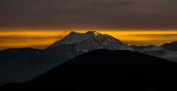 silhouette of mountain with mountain range view during golden time thumbnail