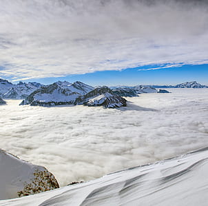 aerial photography of snow-capped mountains at daytime thumbnail