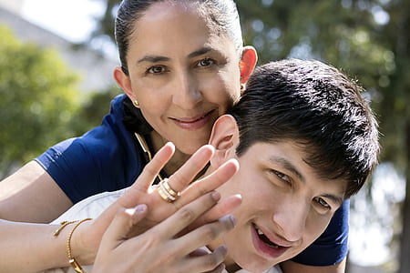 man carrying woman on his back thumbnail