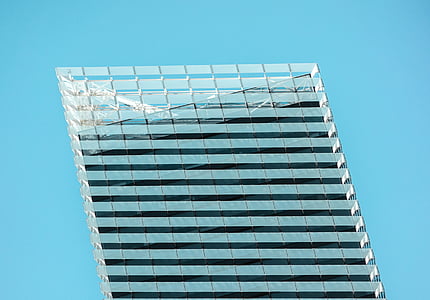 clear glass building under blue sky thumbnail
