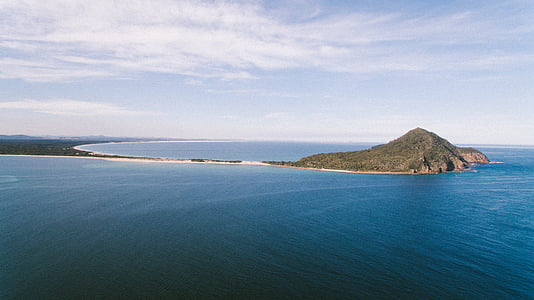 aerial photography of island near sea during daytime thumbnail