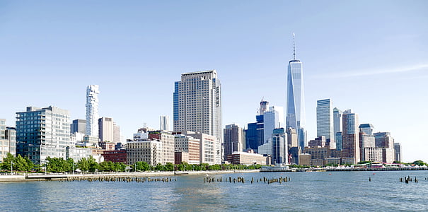 buildings beside body of water at daytime thumbnail