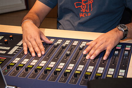 person playing on audio mixer thumbnail