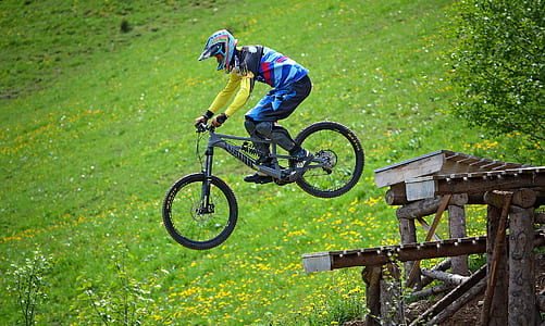 man riding on a bicycle during daytime thumbnail
