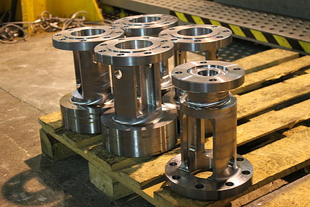five gray engine parts on pallet thumbnail
