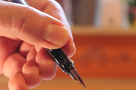 person holding calligraphy pen thumbnail
