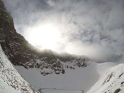 mountain peak under white clouds thumbnail