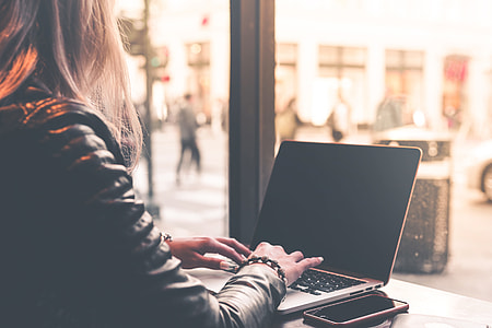 Digital Nomad Millenial Woman Working Remotely from Café thumbnail