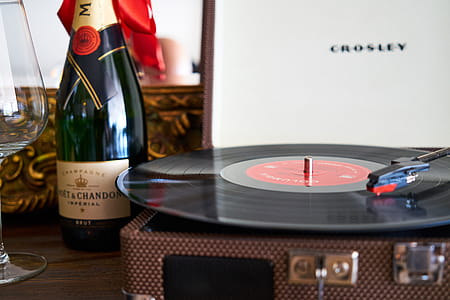 Black Turntable Beside Liquor Bottle thumbnail