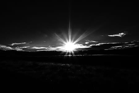 grayscale photography of sun rays thumbnail