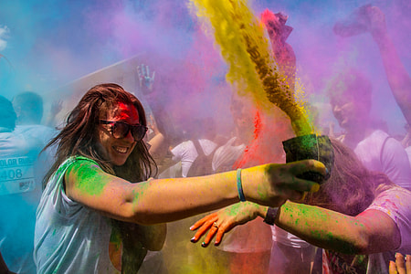 woman holding cup with color powder thumbnail