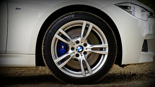 white BMW car parked ahead thumbnail