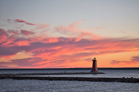 Lighthouse Surrounded by Body of Water thumbnail