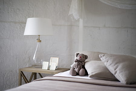 amigurumi bear doll on white bed sheet thumbnail