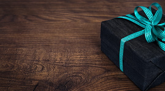 black gift box with blue ribbon thumbnail