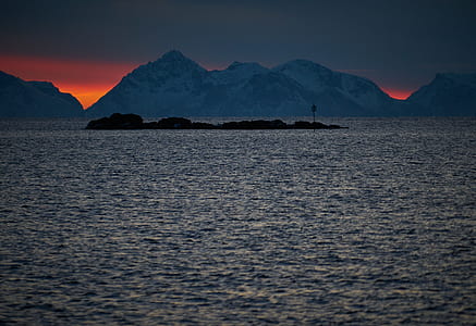 body of water with mountains thumbnail