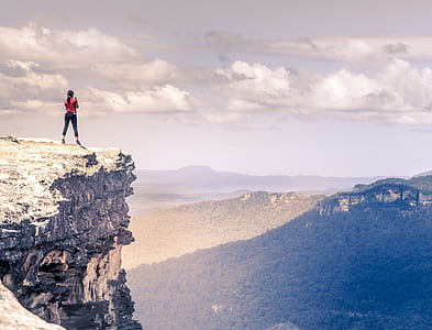 woman standing on top of mountain thumbnail