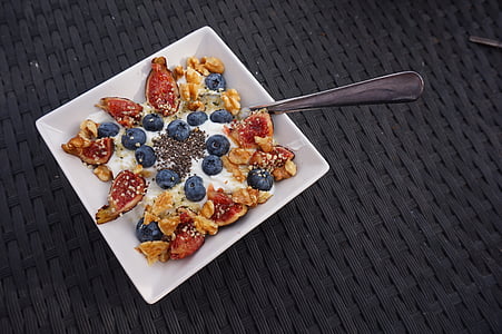 bowl of cereals with berries and nuts thumbnail