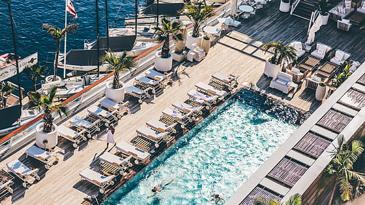 chaise lounge near swimming pool thumbnail