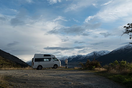 person standing beside van outdoor thumbnail