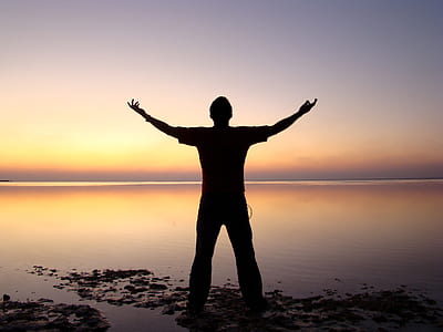 man's silhouette on a lake thumbnail