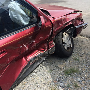 photo of wrecked red vehicle thumbnail