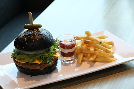 black cheeseburger with fried fries on plate thumbnail