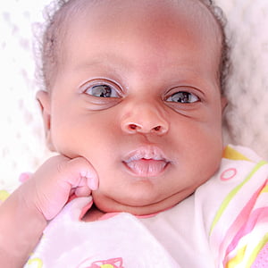 shallow focus photography of baby lying on crib thumbnail